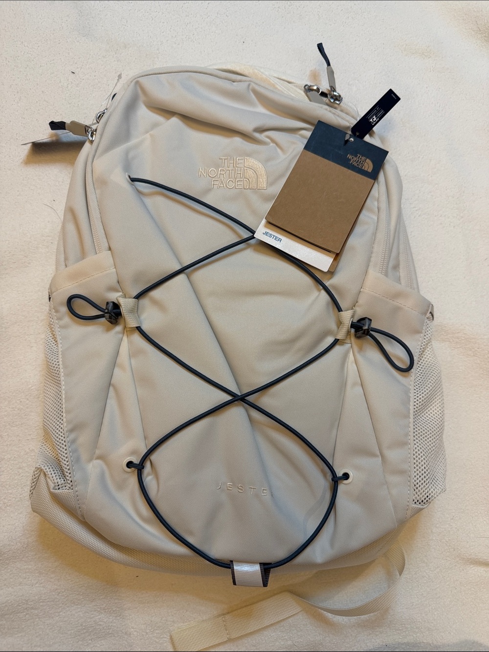 The North Face Jester Backpack in Beige with Black Bungee